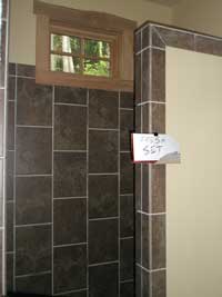 A beautiful shower, complete except for the grout